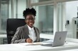 © New Africa - Happy woman working at table in office. Lawyer, businesswoman, accountant or manager