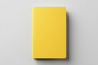 Mockup blank yellow book on white design paper background.