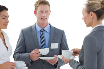 Sticker - Digital png photo of diverse business people drinking coffee and talking on transparent background