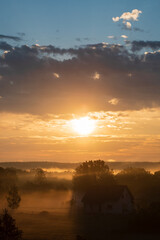 Wall Mural - sunset over village in belarus
