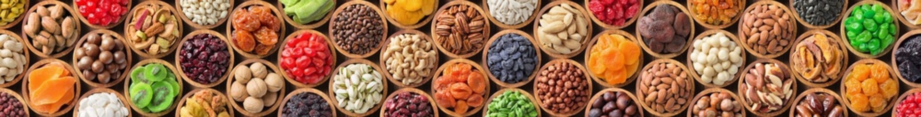 Wall Mural - assorted nuts and dried fruit. long panoramic food background.