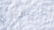 雪の地面を俯瞰したテクスチャー、冬の背景素材
