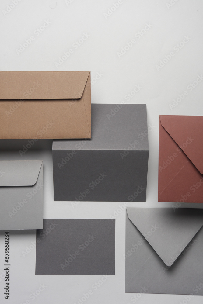 Floating envelopes and cards on gray background with shadow. Minimalism, modern business still life, creative layout