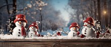 Christmas Tree Branches With Snowman And Ornaments On A Wooden Background. Background Of The Winter Vacations..
