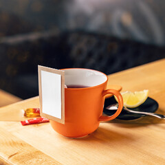 Wall Mural - Mug of tea on the wooden table