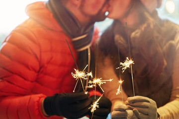 Wall Mural - Photo of couple with New Year sparklers