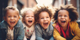 Fototapeta  - Happy laughing children standing together outside. Concept of friendship.