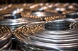 close-up of aluminum wire coils in a manufacturing plant