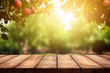 empty wooden table in sunny apple garden