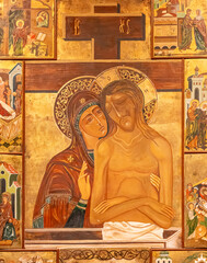 Wall Mural - Close-up on religious illustration of Virgin Mary and Jesus Christ painted on wooden wall of old italian church