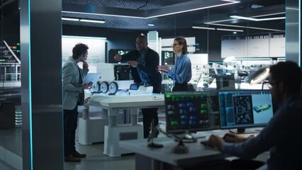 Fototapete - Diverse Team of Industrial Specialists Working on Remotely Controlled Robot. Young Male and Female Engineers in a Lab Discussing an Autonomous AI Delivery Assistant Prototype, Brainstorming