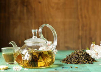 Canvas Print - traditional green tea in a teapot relaxation ceremony