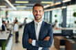 © Synthetica - Portrait of young smiling businessman in office.
