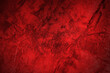 Red grunge background. Abstract red texture. Old scratched bright red paint surface wide texture. Dark scarlet color gloomy grunge abstract widescreen background	