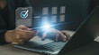 © Khuefa - Document management performance checklist, businessman using checklist survey online. Manager is verifying the validity, security, approving, quality assurance by checkmark selection document.
