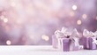  two purple gift boxes with a white ribbon and a bow on a white table with a boke of lights in the background.