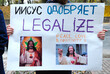 Young people hands holding broadsheet demanding legalization of medical marijuana. Cannabis March