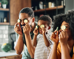 Wall Mural - child family kitchen food boy son mother father meal fun preparing healthy diet eating home black african american man happy ingredient having fun game joy bonding kid cute