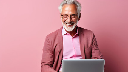 Wall Mural - Smiling cheerful smart senior man wearing casual teenage clothes using laptop computer pose looking at camera isolated color background