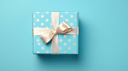 Sticker - A nice gift box decorated craft papper with a bow on blue background. New Year, Christmas, birthday, Valentines Day, World Womans Day, Fathers Day. top view