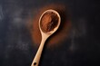 a wooden spoon with powder on it