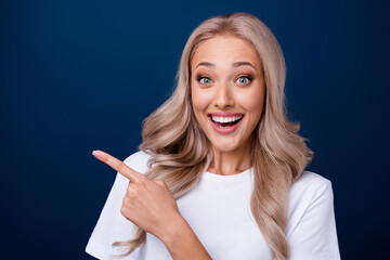 Canvas Print - Photo of cheerful gorgeous girl wear stylish outfit demonstrate profitable proposition empty space isolated on dark blue color background