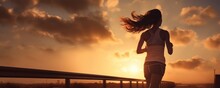 Beautiful Woman Running Early Morning Sunrise, Workout On Misty Mountain Road Workout Jog. Runner Athlete. Fitness And Workout Wellness. Healthy Life And Sport Concept
