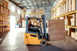 © Marko Geber - Male Forklift Operator at Work in Warehouse