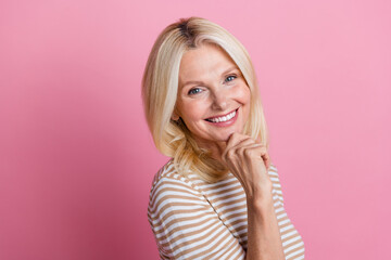 Canvas Print - Portrait of toothy beaming woman with stylish hairdo wear trendy clothes holding fingers on chin isolated on pink color background