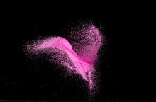 Pink Sand Flying Explosion, Particle Dot Grain Wave Explode. Abstract Cloud Fly. Choky Pink Colored Sand Splash Throwing In Air. Black Background Isolated