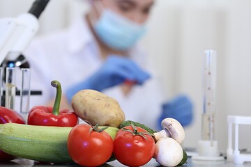 Wall Mural - fresh vegetables on table in laboratory. food quality control