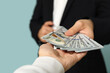 © Pixel-Shot - Young businessman giving bribe on blue background, closeup
