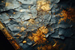 Close-up image of a textured surface with crackled gold and blue paint, creating a luxurious vintage background.