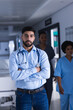 © wavebreak3 - Portrait of biracial male doctor standing in hospital corridor