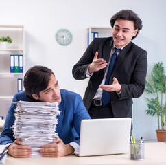 Canvas Print - Two male colleagues unhappy with excessive work