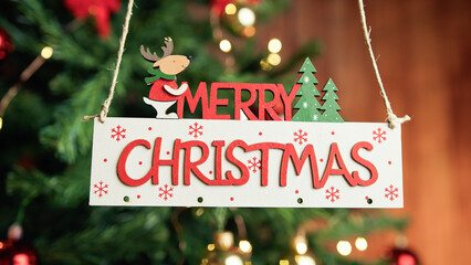Wall Mural - Merry Christmas sign with tree on the background