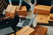 © Sirikarn Rinruesee - Business woman start up small business entrepreneur SME success .freelance woman working at home with Online Parcel delivery. SME and packaging deliveryconcept