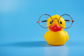 Wall Mural - Rubber duck in glasses, creative study, cute toy, playful vision, smart ducky, edication