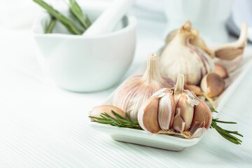 Poster - Fresh garlic bulbs with rosemary.