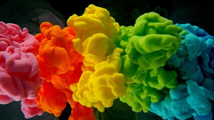 Poster - Colourful Rainbow Paint Drops Mixing in Water.