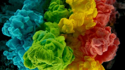 Poster - Colourful Rainbow Paint Drops Mixing in Water.