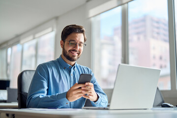 happy professional latin business man company employee, smiling busy young businessman working on la