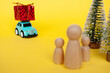Toy car carry present while on a journey back home for Christmas. Christmas and holiday concept