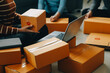 © Sirikarn Rinruesee - Business woman start up small business entrepreneur SME success .freelance woman working at home with Online Parcel delivery. SME and packaging deliveryconcept
