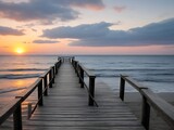Fototapeta Pomosty - Wooden pier on the beach at beautiful sunset in the evening