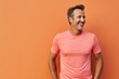 © CogniLens - Portrait of a cheerful man in his 40s wearing a moisture-wicking running shirt against a pastel or soft colors background. AI Generation