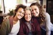 © tbralnina - Three smiling women embracing each other