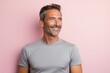 © CogniLens - Portrait of a satisfied man in his 40s sporting a breathable mesh jersey against a solid pastel color wall. AI Generation