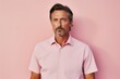© CogniLens - Portrait of a tender man in his 40s sporting a technical climbing shirt against a solid pastel color wall. AI Generation