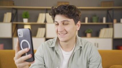 Man making a video call on the phone.